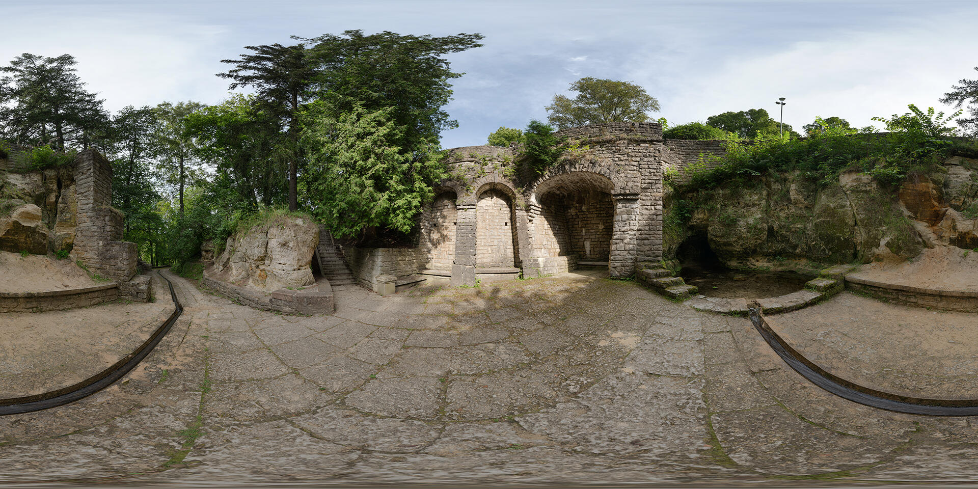 HDRI-panorama-of-a-park-area-with-stone-alcoves-and-a-pond