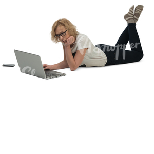 woman lying on the floor and working with her laptop