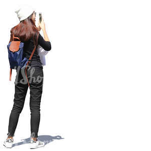 asian woman standing and taking a picture