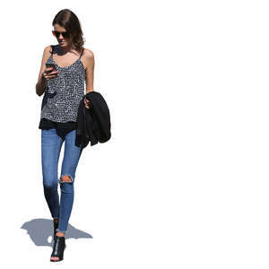 woman walking and checking her phone