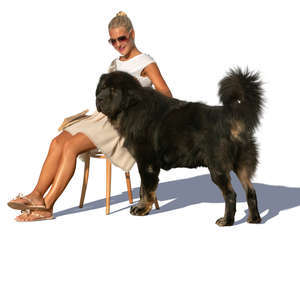 woman sitting and petting her dog