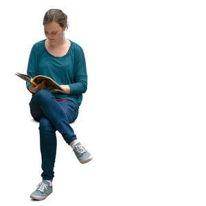 woman sitting and reading a magazine