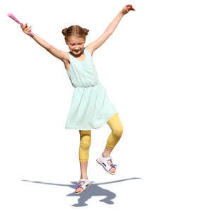 young girl in a summer dress jumping in the air