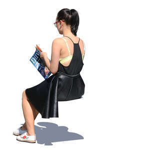 woman sitting and reading a magazine