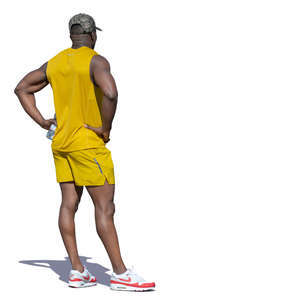 african man in a yellow costume standing