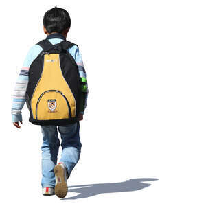 little boy with aschoolbag walking