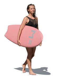 cut out woman with a surfboard walking on the beach