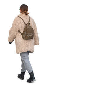 cut out woman in a teddy coat walking