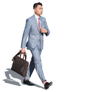 asian man in a gray suit walking