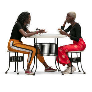 two cut out women sitting in a cafe and talking over coffee