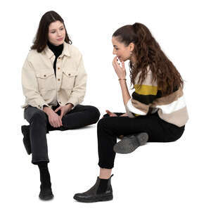 two cut out women sitting and talking