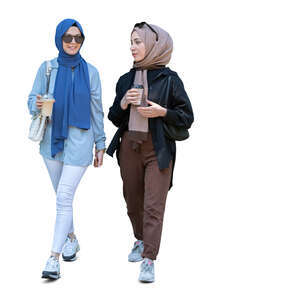 two cut out young muslim women walking and drinking coffee