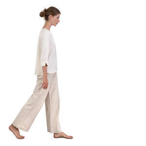 woman in white clothing walking barefoot