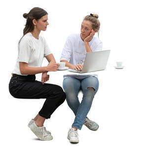 two women with laptop sitting and drinking coffee
