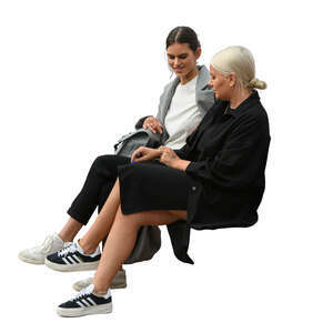 two women sitting and talking