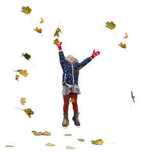 little girl jumping and playing with autumn leaves