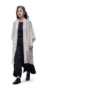 asian woman in relaxed outfit walking