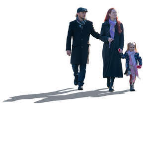 backlit family with a little daughter walking hand in hand in autumn