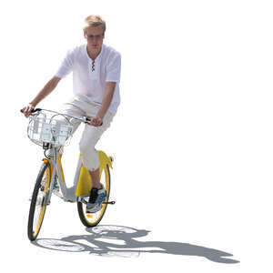 backlit young man riding a bike