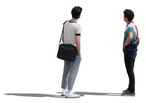 two men standing and looking at smth