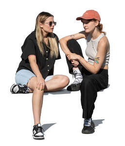 two women sitting and talking