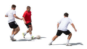 three cut out men playing street football