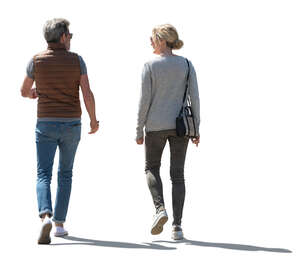 two cut out backlit people walking