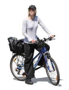 woman with a baseball hat riding a bike