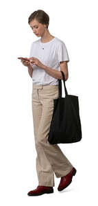 cut out woman with a phone walking