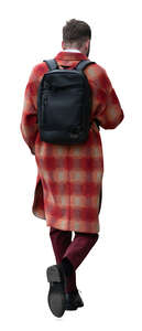 cut out man in a red coat walking