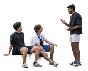 two cut out men sitting and talking to a third friend standing