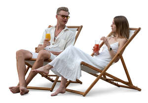 cut out two people sitting in a resort cafe and drinking cocktails