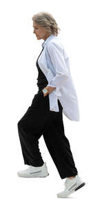 senior woman walking up the stairs