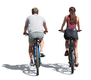 back view of two people riding bicycles