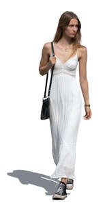 cut out woman in a white summer dress walking
