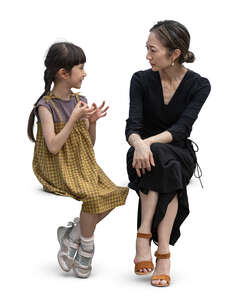 cut out japanese woman and child sitting together
