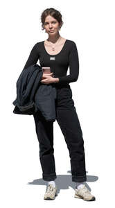 young woman in casual black outfit standing