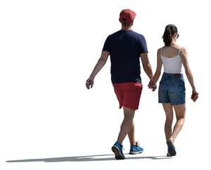 cut out backlit young couple walking in summer