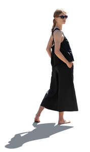 cut out woman standing in backlight and looking back over her shoulder