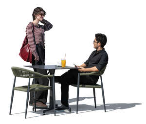 woman talking to a friend sitting in a restaurant