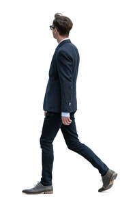 cut out young man in a suit walking