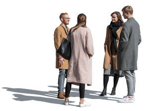 group of people standing outside on a sunny autumn day