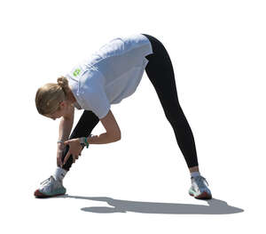 cut out backlit woman doing stretching exercises outside