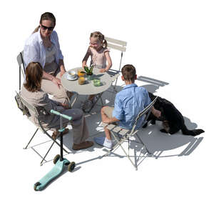 top view of a woman with kids and a dog sitting in a restaurant