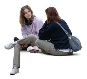 two women sitting casually and talking