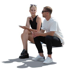 two people sitting in backlight