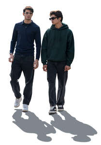 two cut out backlit dark haired men walking