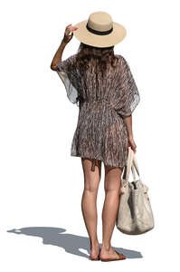 woman in light resort dress standing and looking around