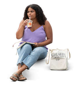 young american woman sitting and drinking ice coffee