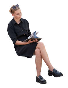 cut out woman sitting and reading seen from above